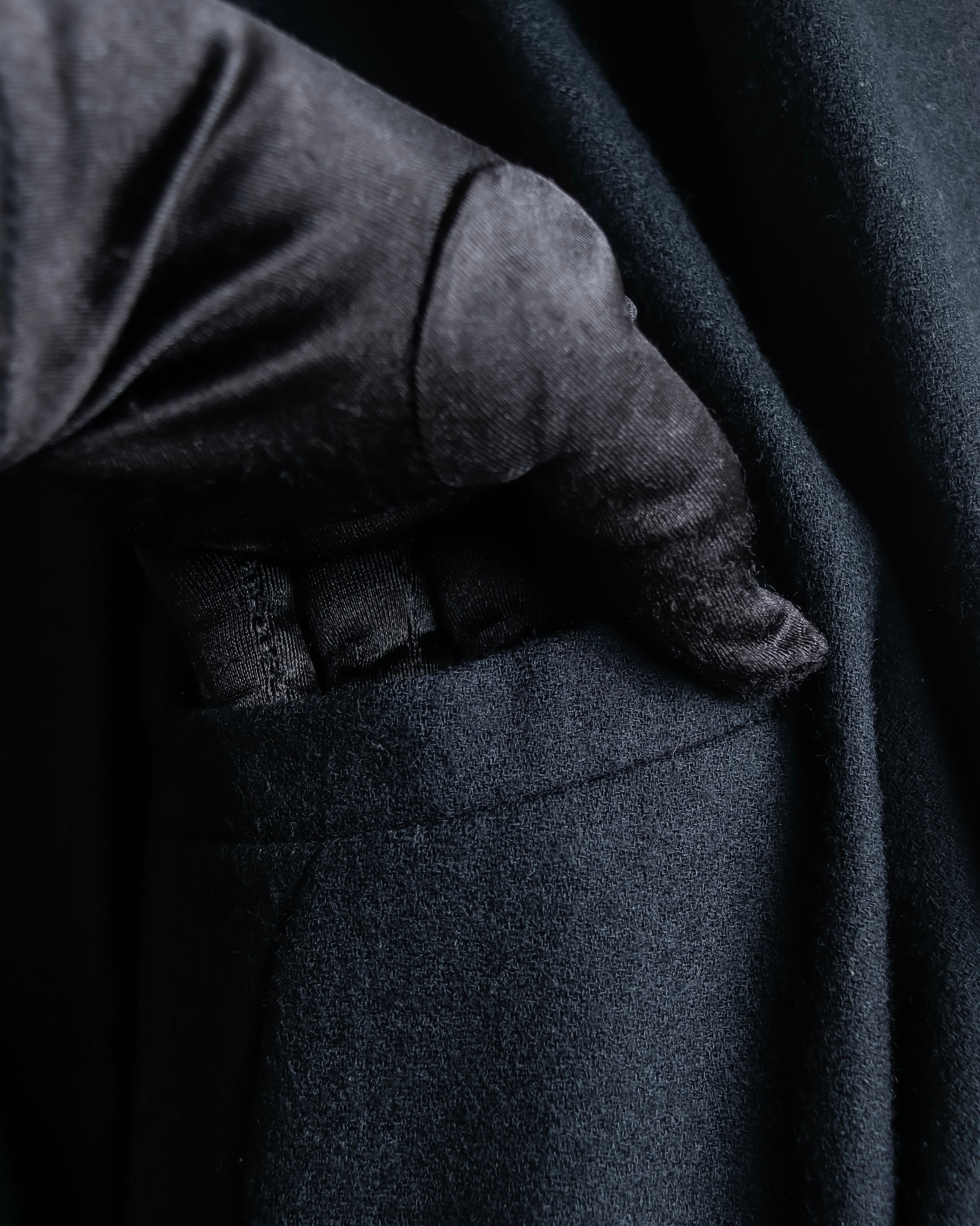 Tight-waisted wool shirt and black coat