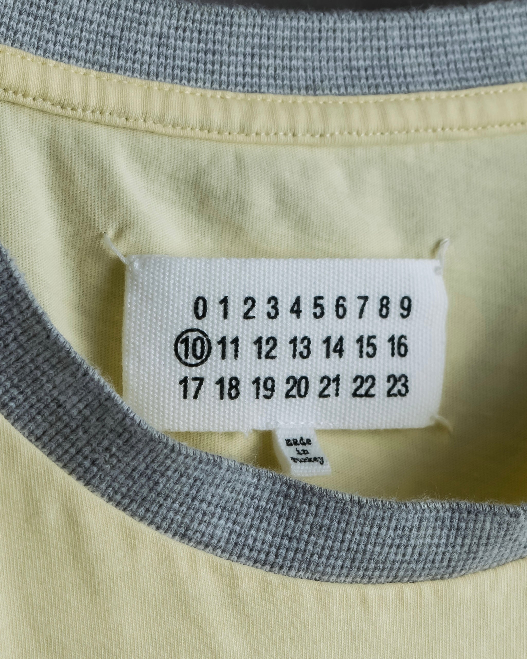 "MAISON MARGIELA"
Pastel yellow color box silhouette T-shirt