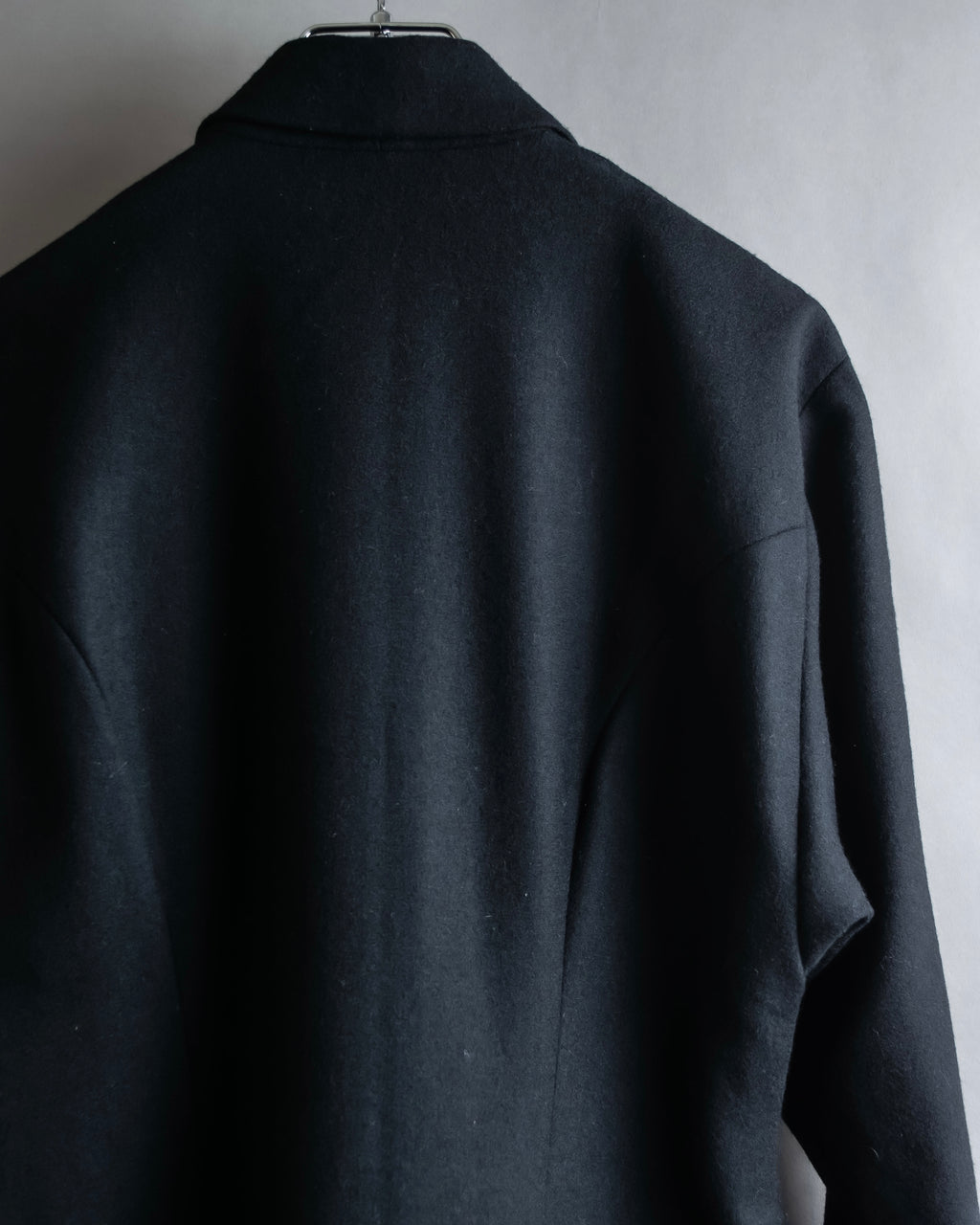 Tight-waisted wool shirt and black coat