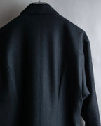 Tight-waisted wool shirt and black coat