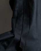 Tight-waisted wool shirt and black coat