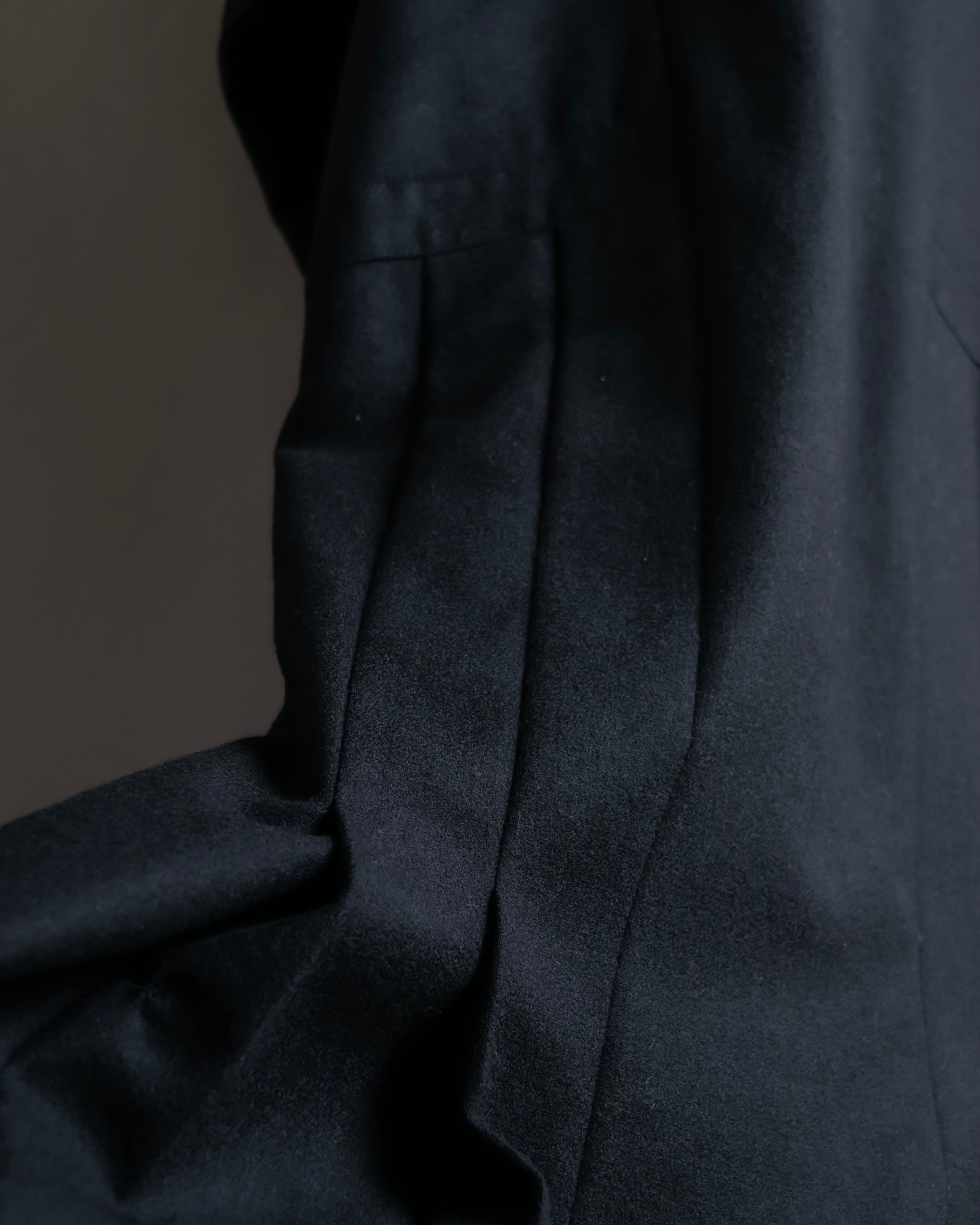 Tight-waisted wool shirt and black coat