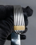 "Christian Dior" Ribbed design gold combination polished silver bangle