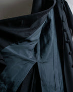 Tight-waisted wool shirt and black coat