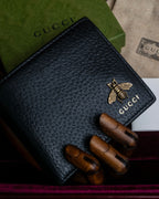 "GUCCI" Gold bee motif animalier bi-fold leather wallet