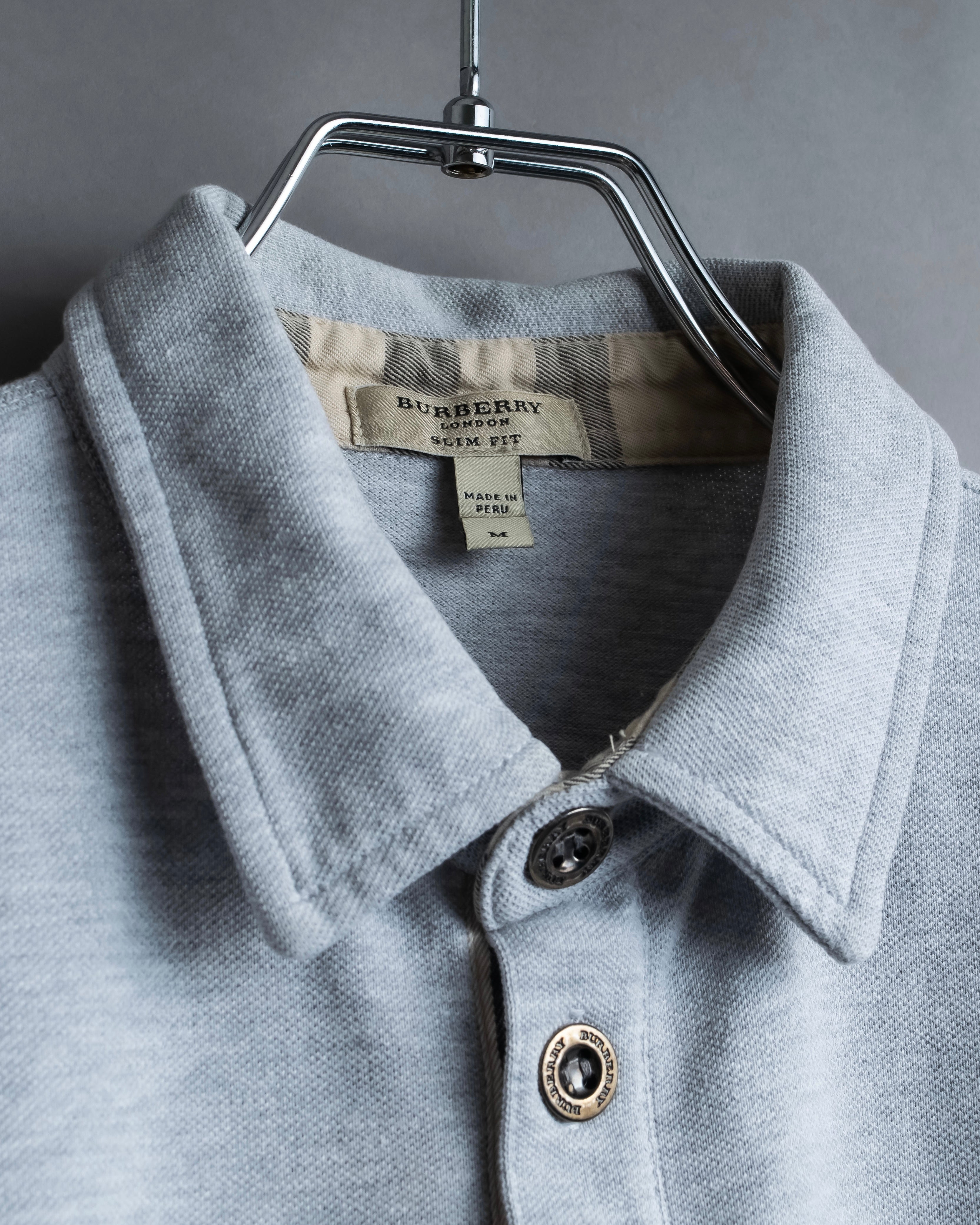 "BURBERRY" Knight logo engraved metal button polo shirt