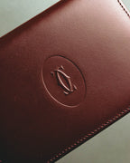 “Cartier” 90’s Must de Cartier burgundy embossed leather bifold wallet