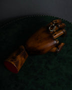 "Alexandar McQueen" Horseshoe motif red stone top ring