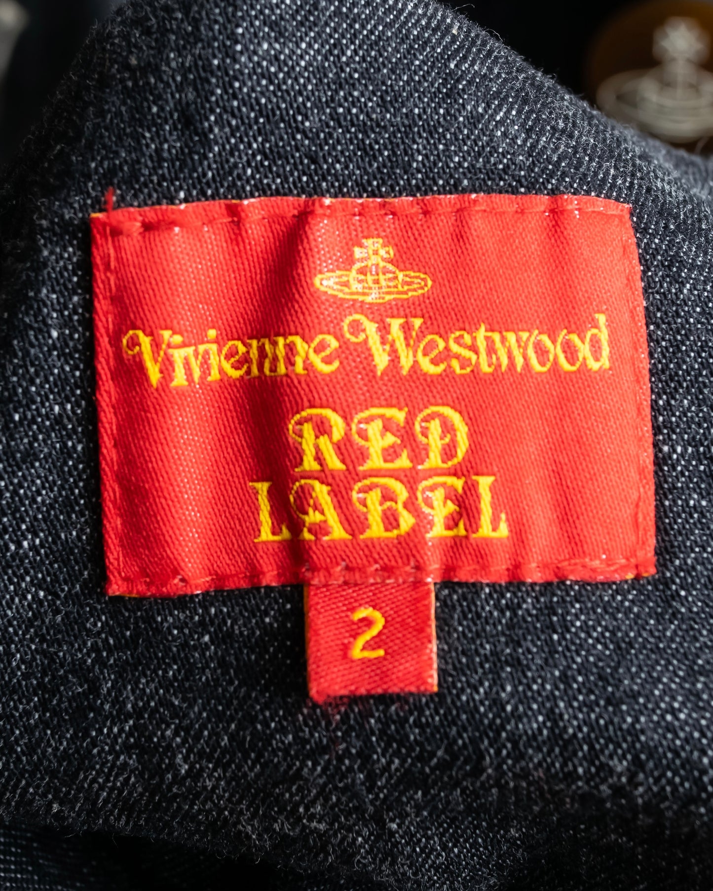 "Vivienne Westwood RED LABEL" Asymmetrical button design mid length denim coat