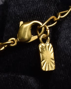"YVES SAINT LAURENT" Embossed medallion YSL charm necklace