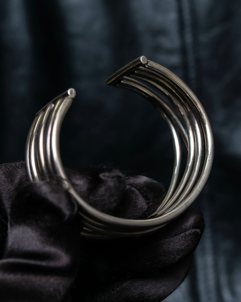 “PHILIPPE AUDIBERT” Crossed 5 line silver bangle