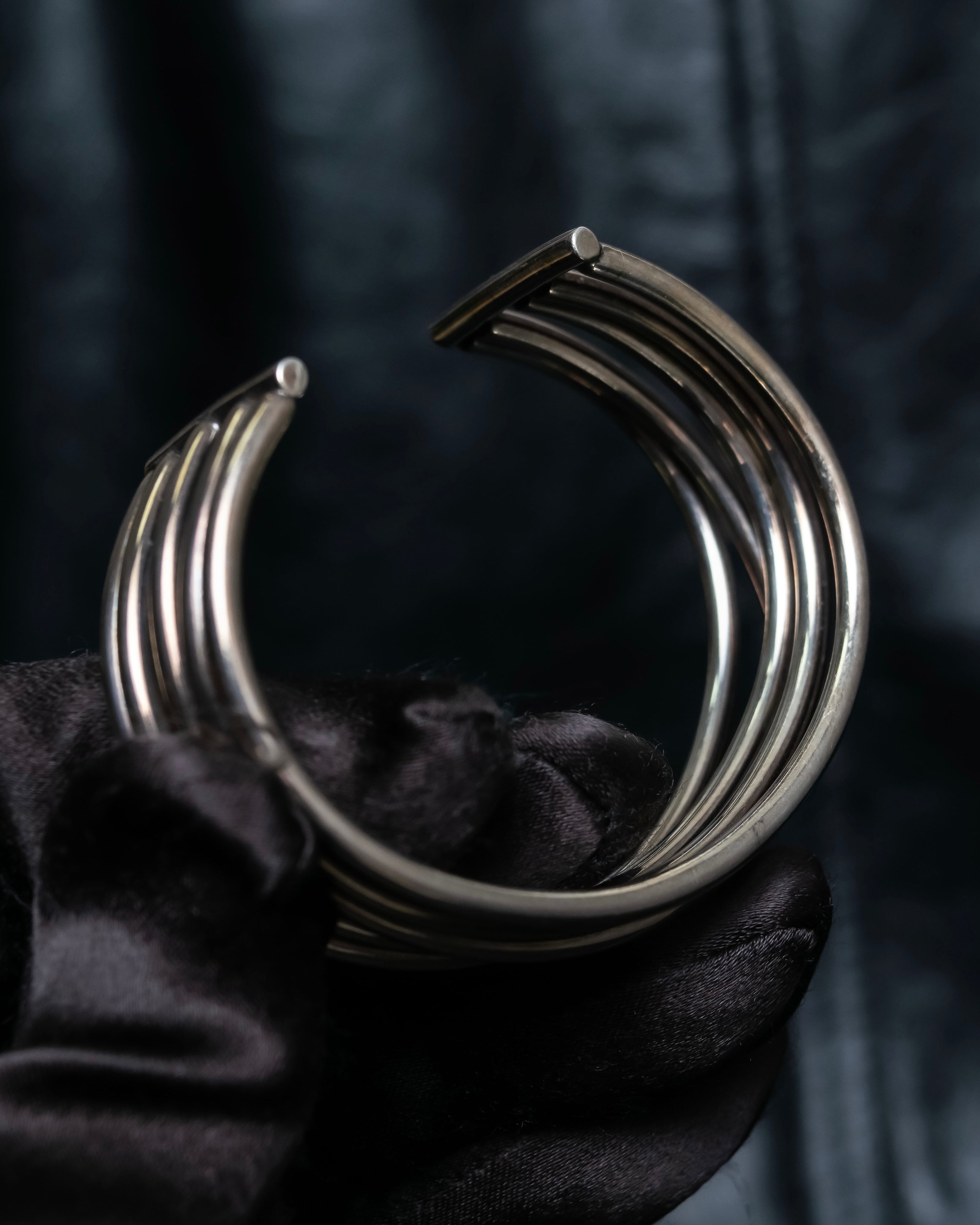 “PHILIPPE AUDIBERT” Crossed 5 line silver bangle