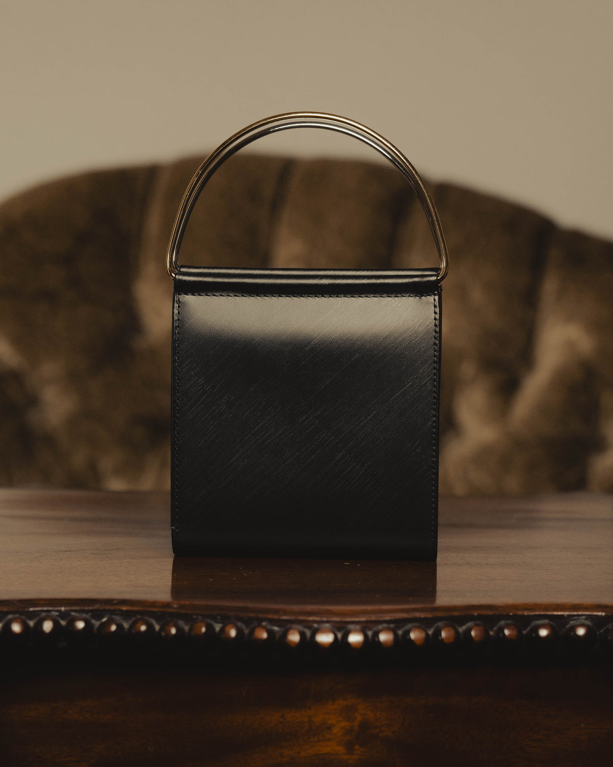 "Cartier" 80's Sculptural ring-handle leather wallet