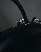 "Y’s" 22AW sculptural kiss-lock leather bag