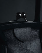 "Y’s" 22AW sculptural kiss-lock leather bag