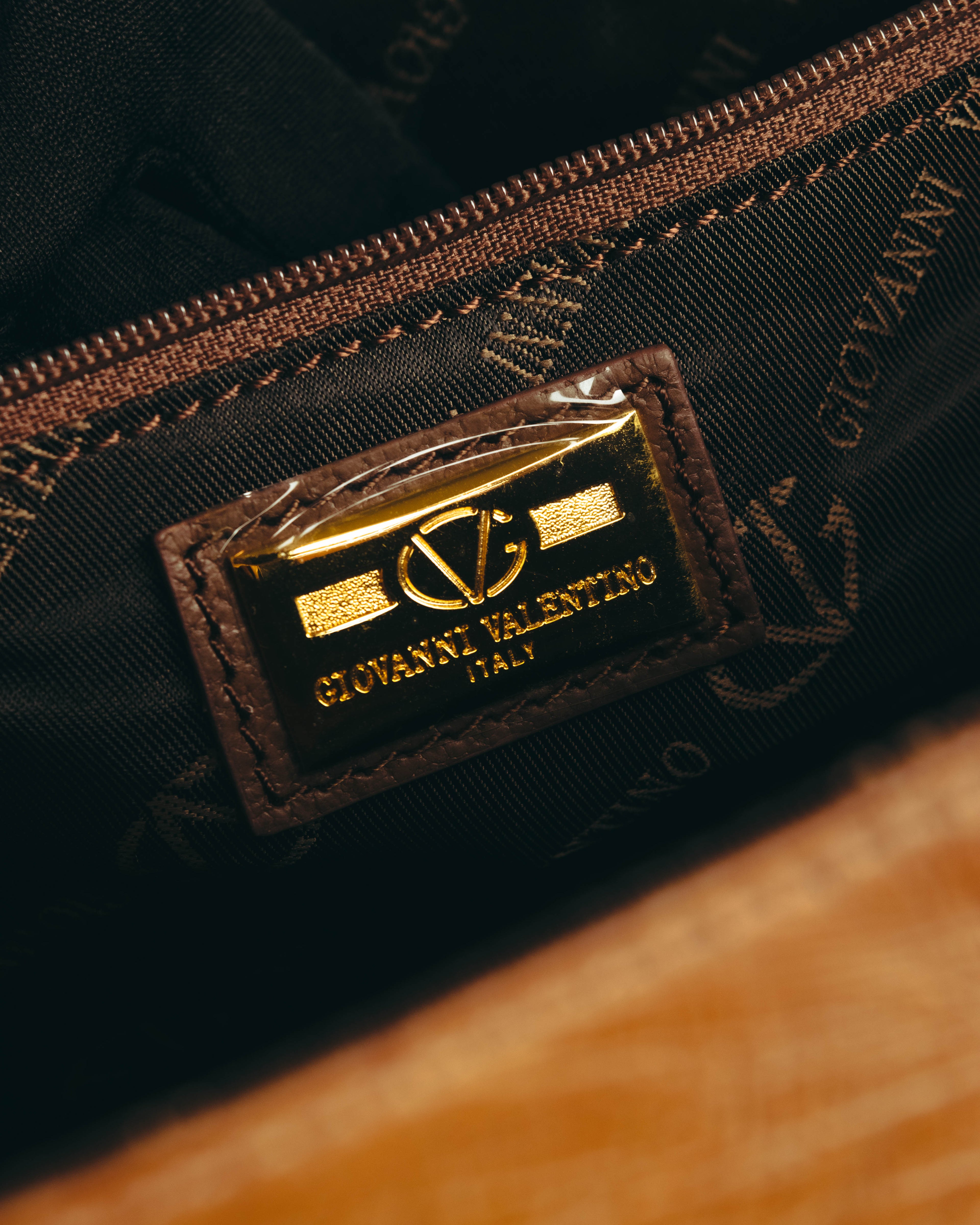 “GIOVANNI VALENTINO” Structured ostrich top handle bag