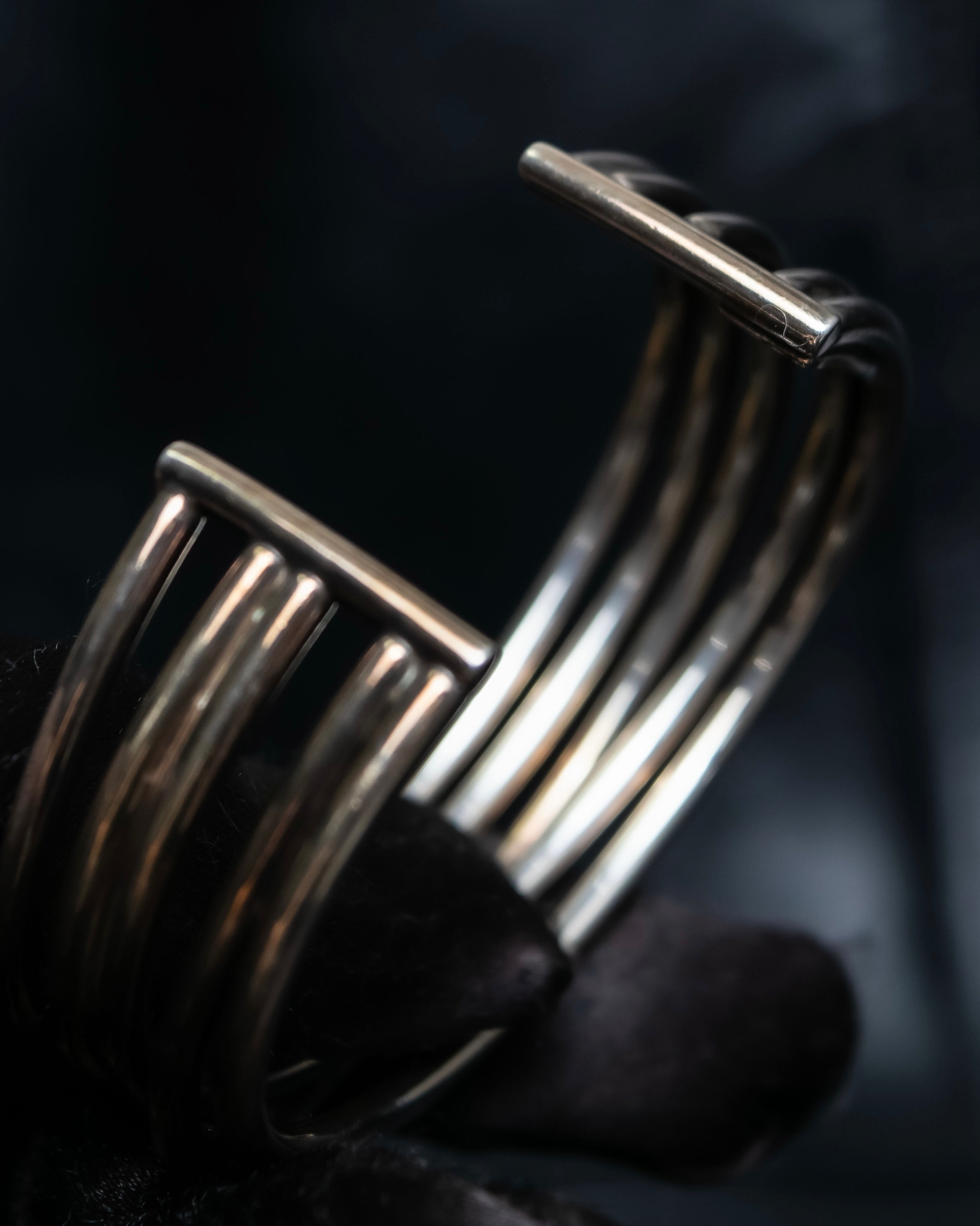 “PHILIPPE AUDIBERT” Crossed 5 line silver bangle