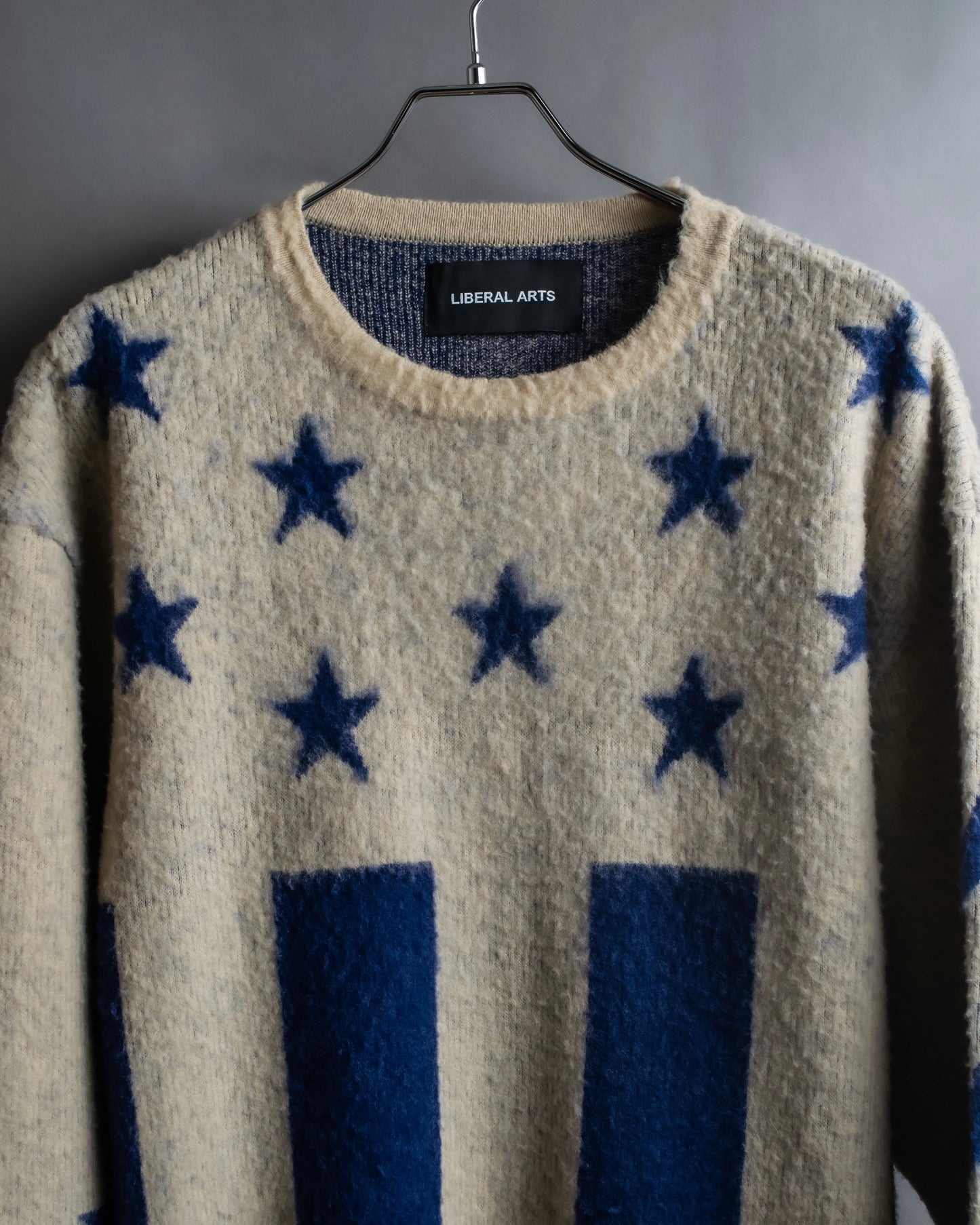 "LIBERAL ARTS" Star pattern oversized knit pullover