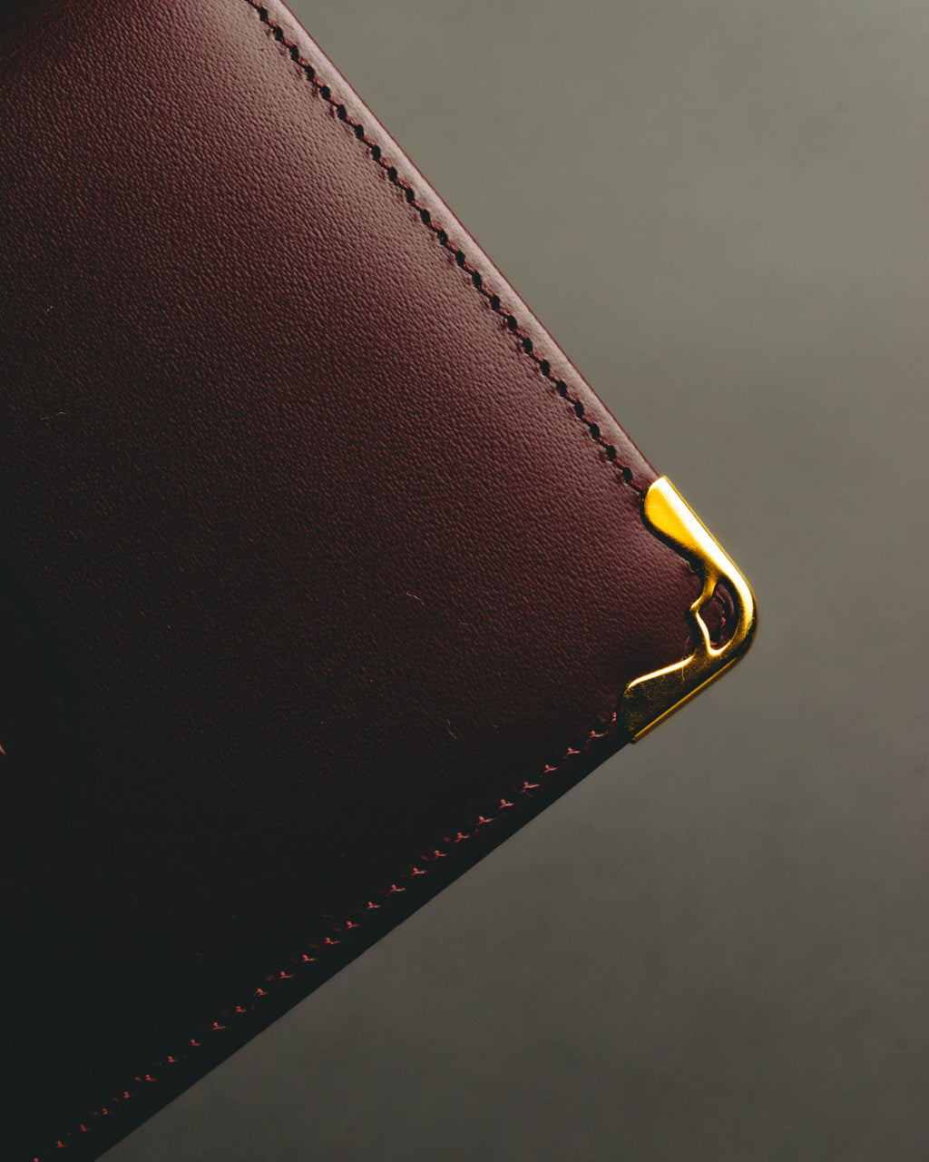“Cartier” 90’s Must de Cartier burgundy embossed leather bifold wallet