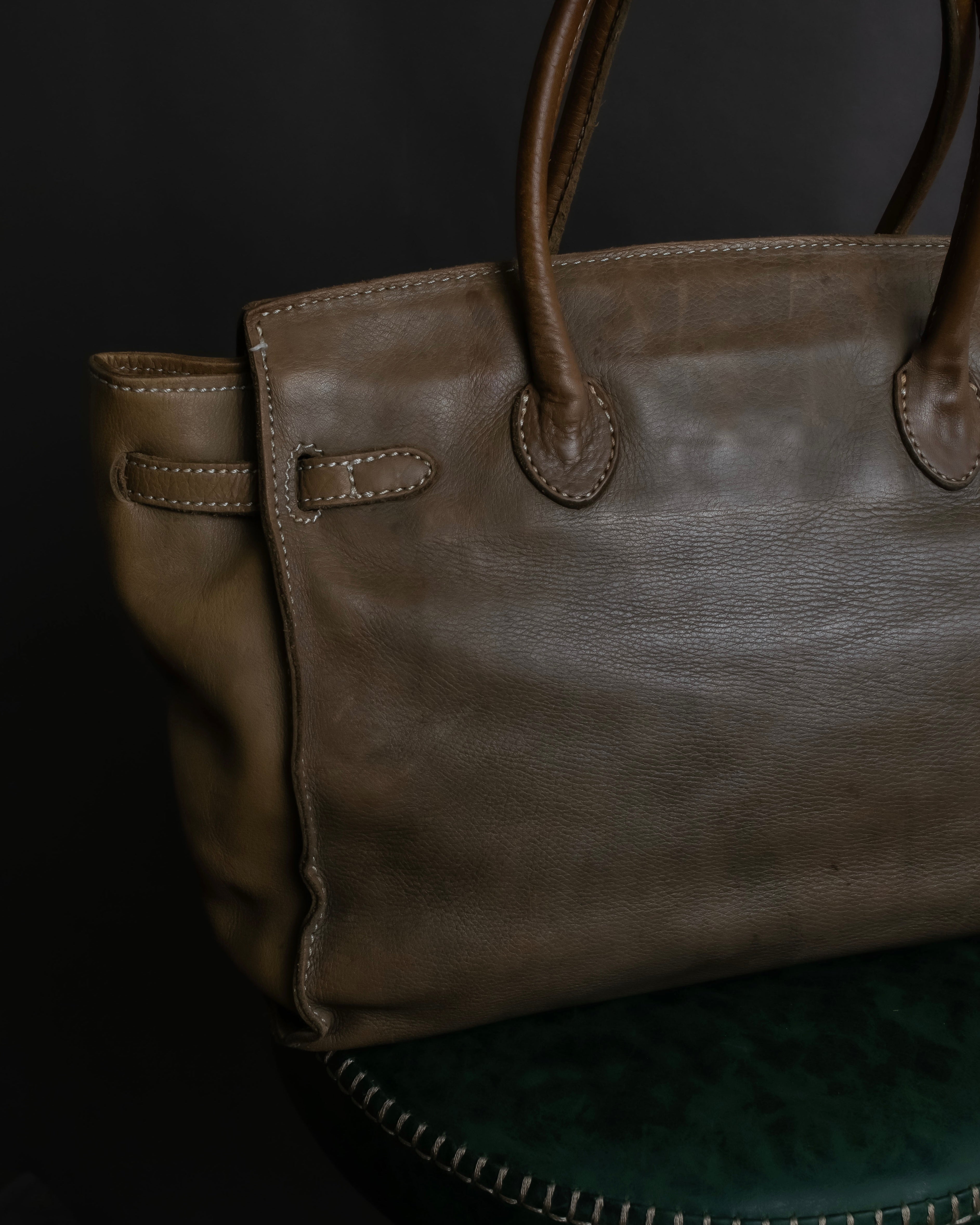 "Mademoiselle Accessories"
 Silver parts design leather one handle bag