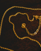 "Christian Dior" 80's-90's Gold tone bottle pendant necklace