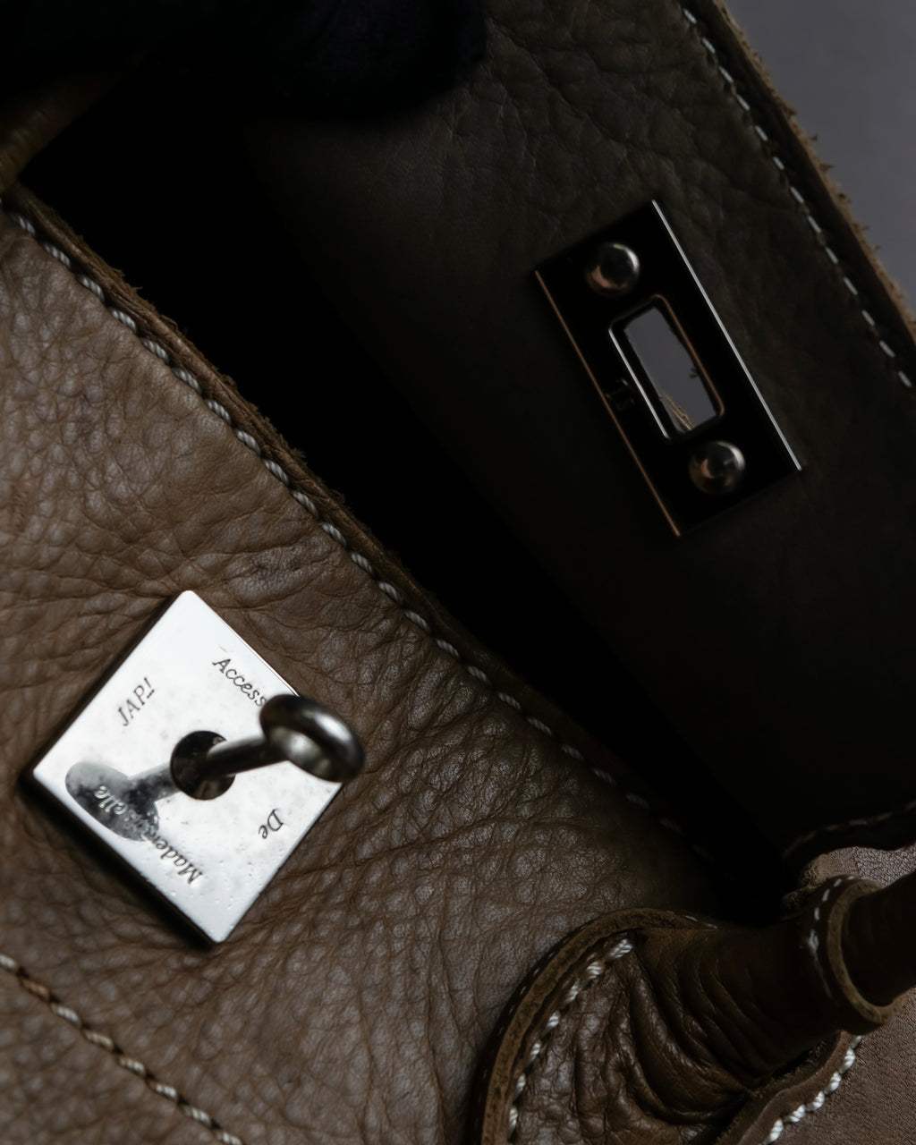 "Mademoiselle Accessories"
 Silver parts design leather one handle bag