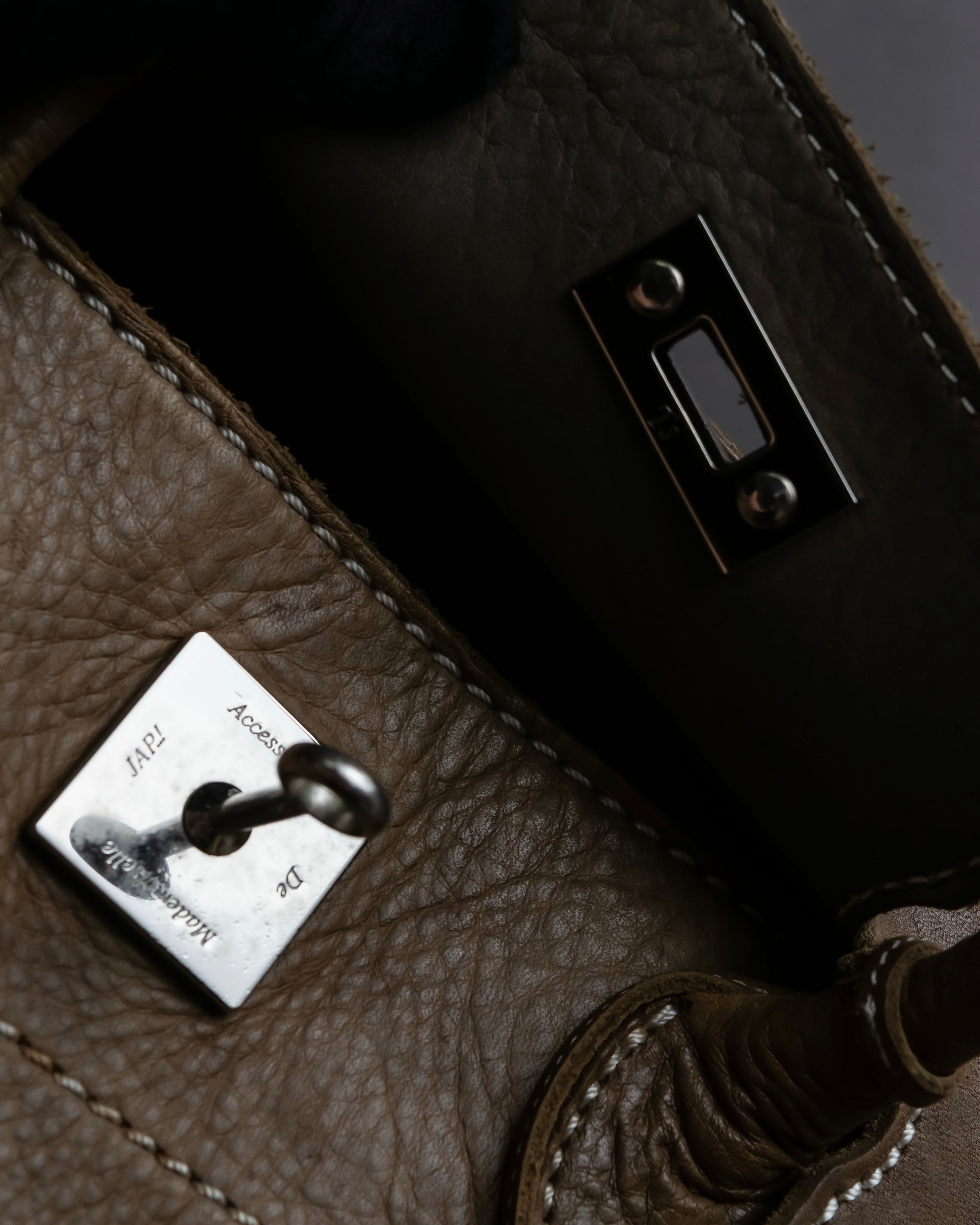 "Mademoiselle Accessories"
 Silver parts design leather one handle bag