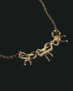 "Tiffany & Co." 80's-90's Sculptural triple bow necklace