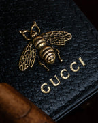 "GUCCI" Gold bee motif animalier bi-fold leather wallet