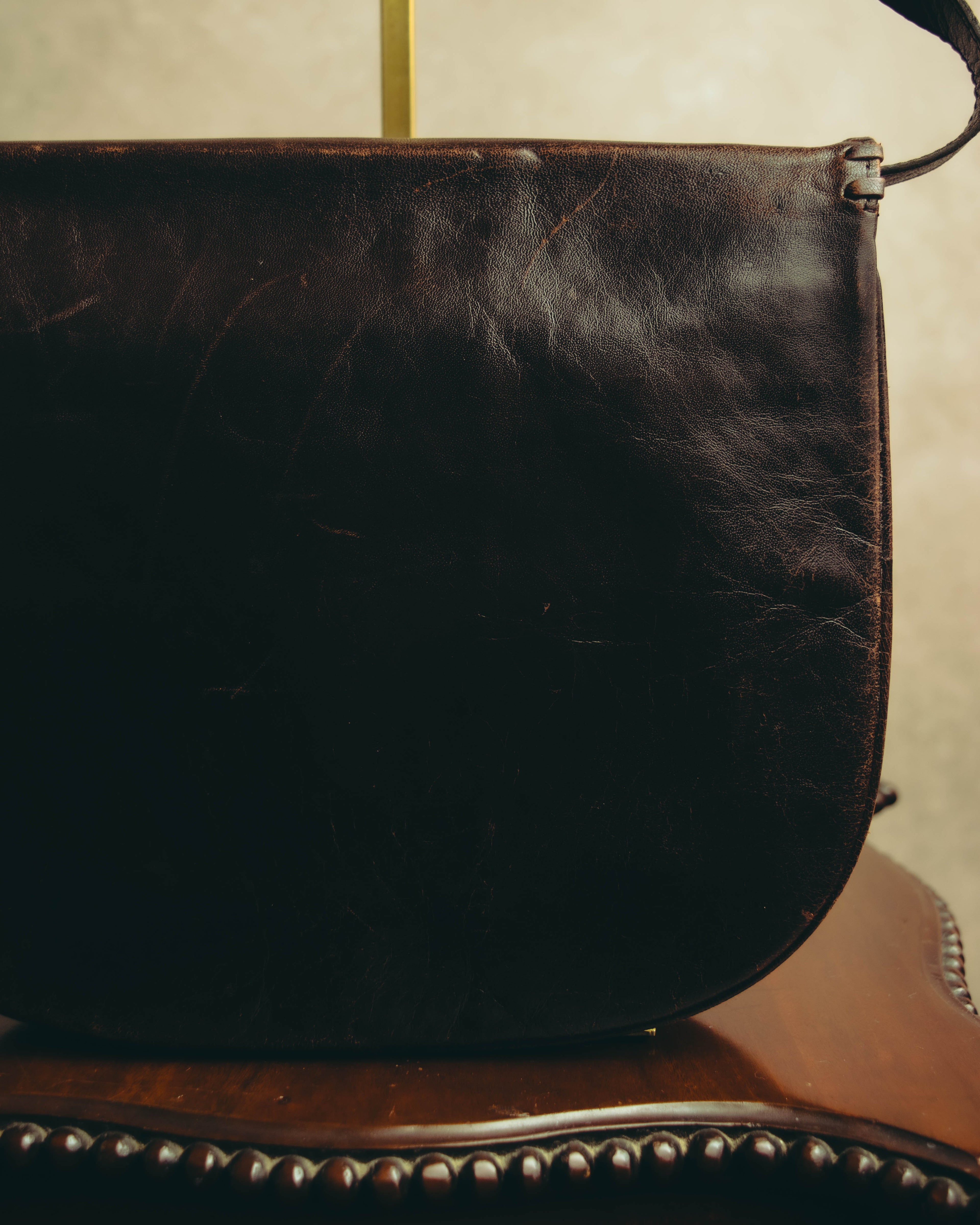 “Yves Saint Laurent” 70’s-80’s Perforated logo leather tassel shoulder bag