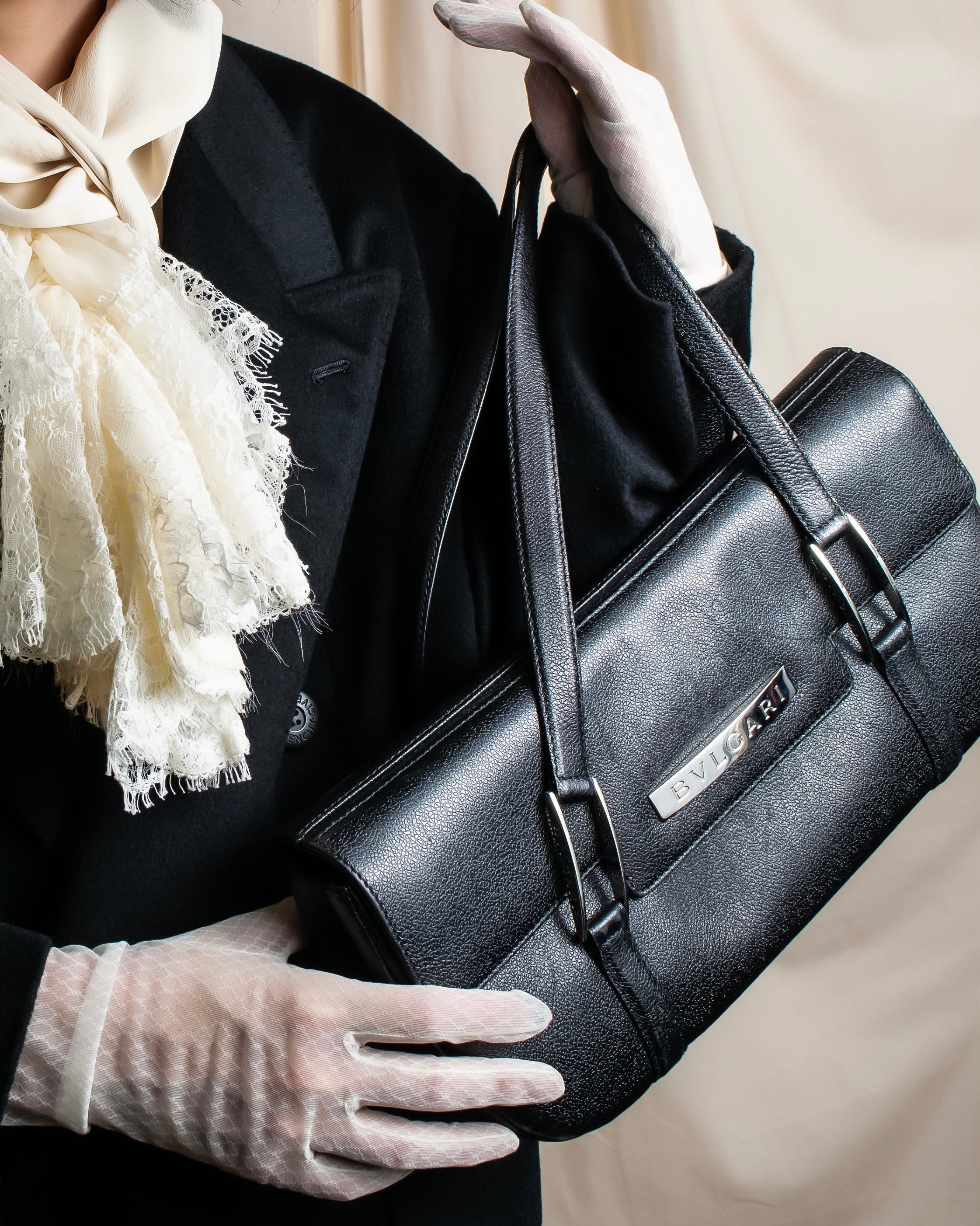 "BVLGARI" Horizontal form engraved logo leather bag