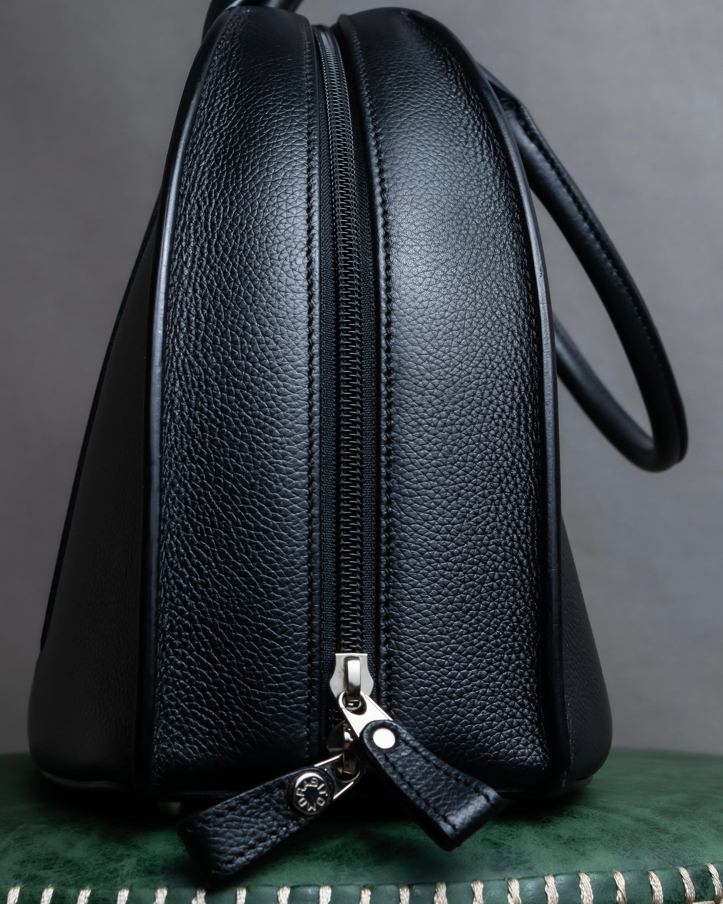 "MORABITO" Half moon design grained leather handbag