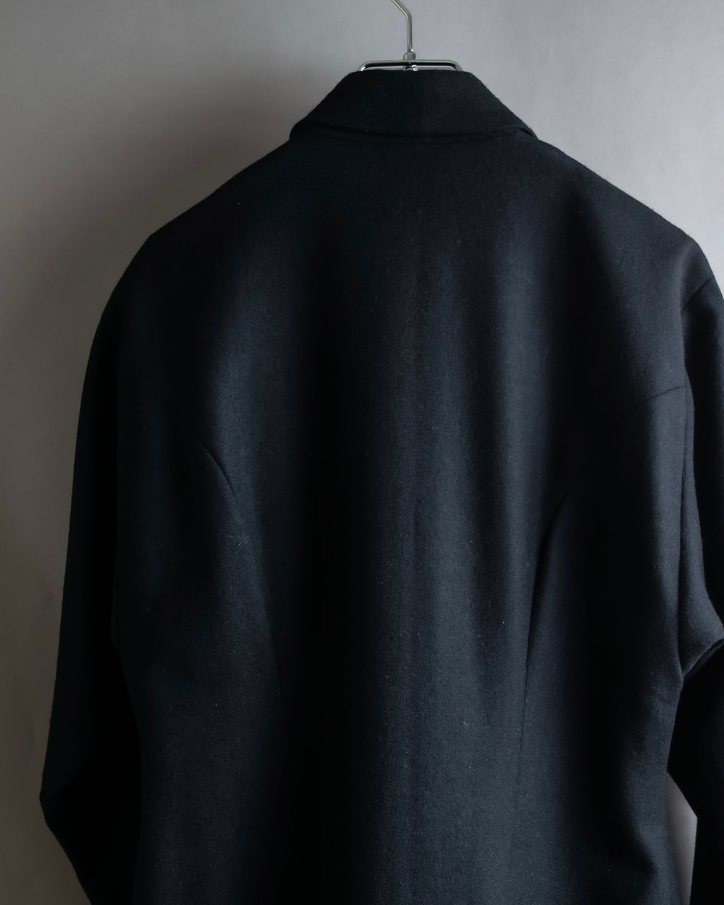 Tight-waisted wool shirt and black coat