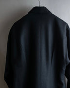 Tight-waisted wool shirt and black coat