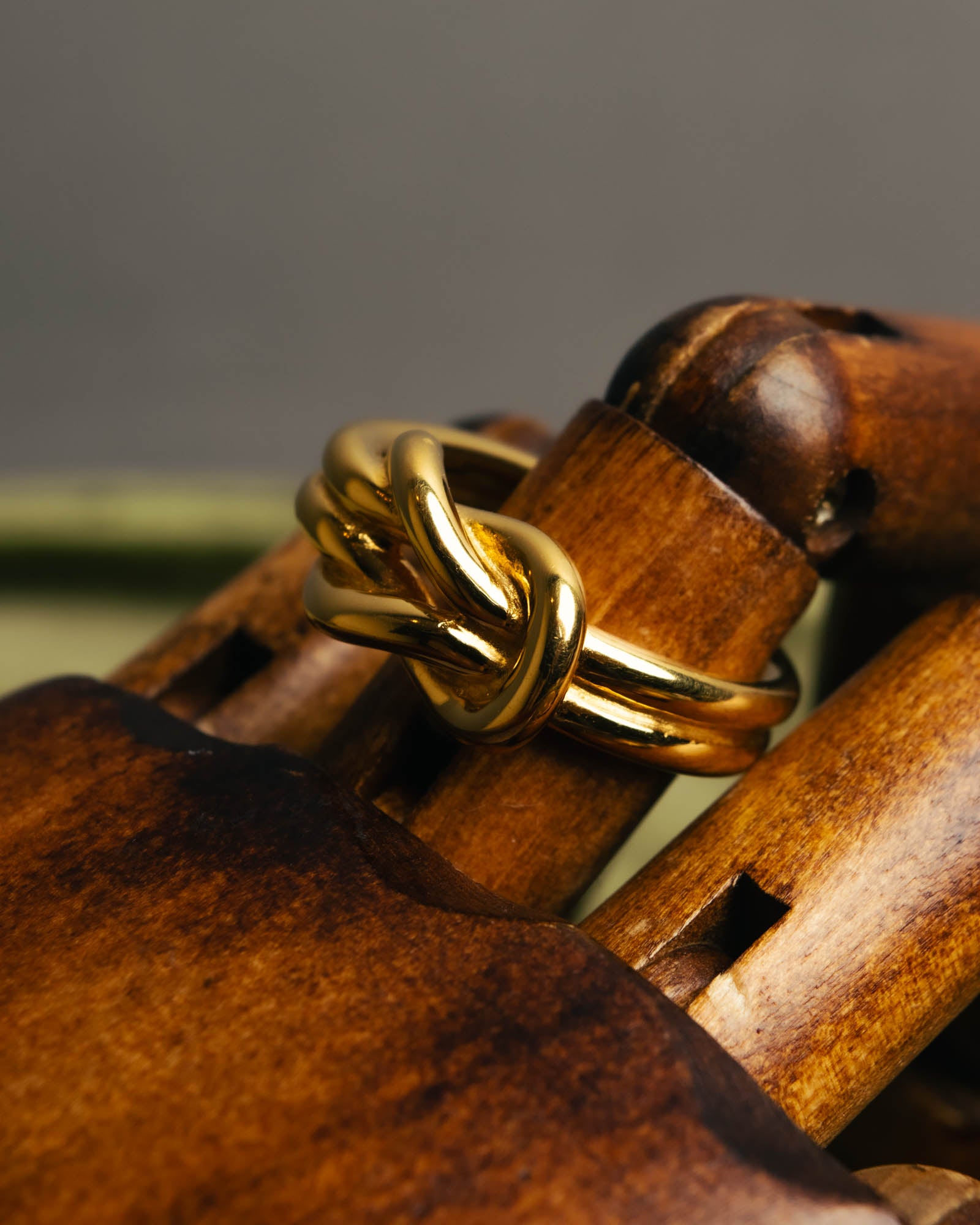"HERMES" Sculptural gold tone knot Atame scarf ring
