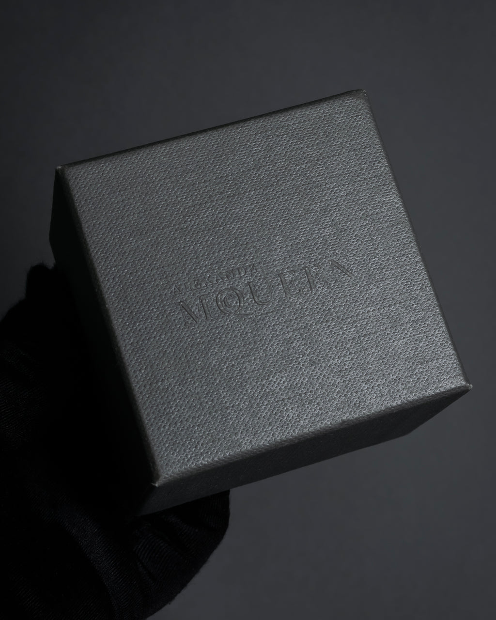 "Alexandar McQueen" Horseshoe motif red stone top ring