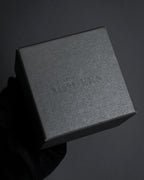 "Alexandar McQueen" Horseshoe motif red stone top ring