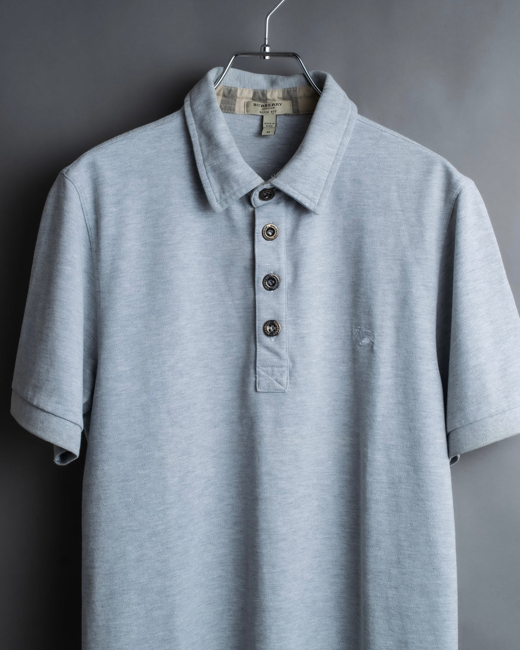 "BURBERRY" Knight logo engraved metal button polo shirt