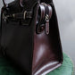 "HAMANO TOKYO" Trapezoidal shape iconic hardware leather one handle bag