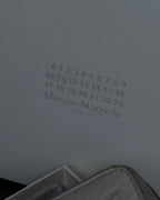"MAISON MARGIELA" White grain leather round zipper wallet