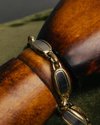 "Christian Dior" 70's-80's Two-tone gold and charcoal link bracelet