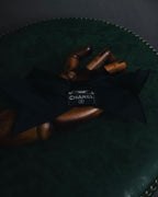 "CHANEL" 90’s black satin and grosgrain ribbon brooch
