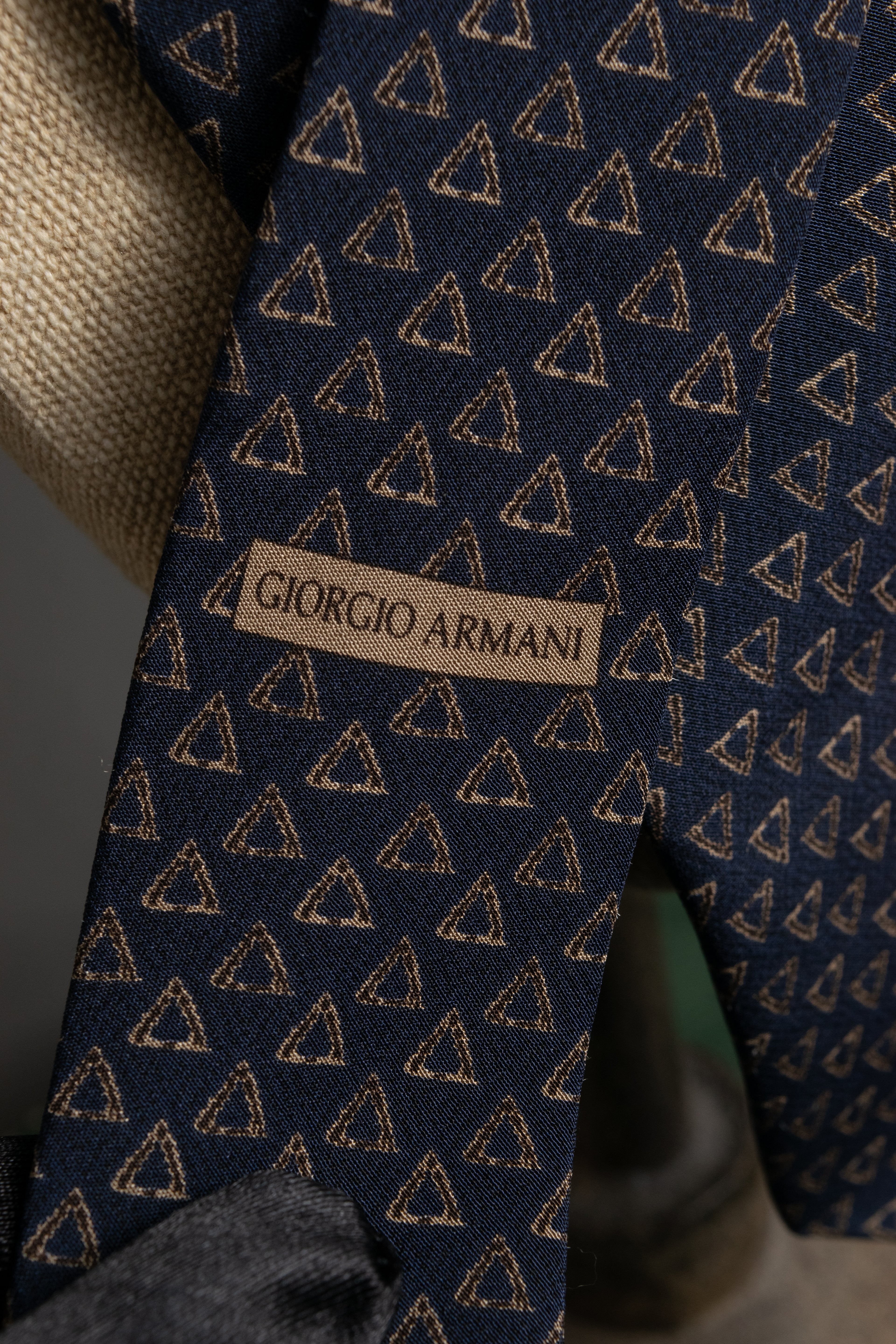 "ARMANI COLLEZIONI" Repeated triangle motif silk neck tie