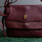 "Cartier" Texture changing bordeaux colored leather shoulder bag