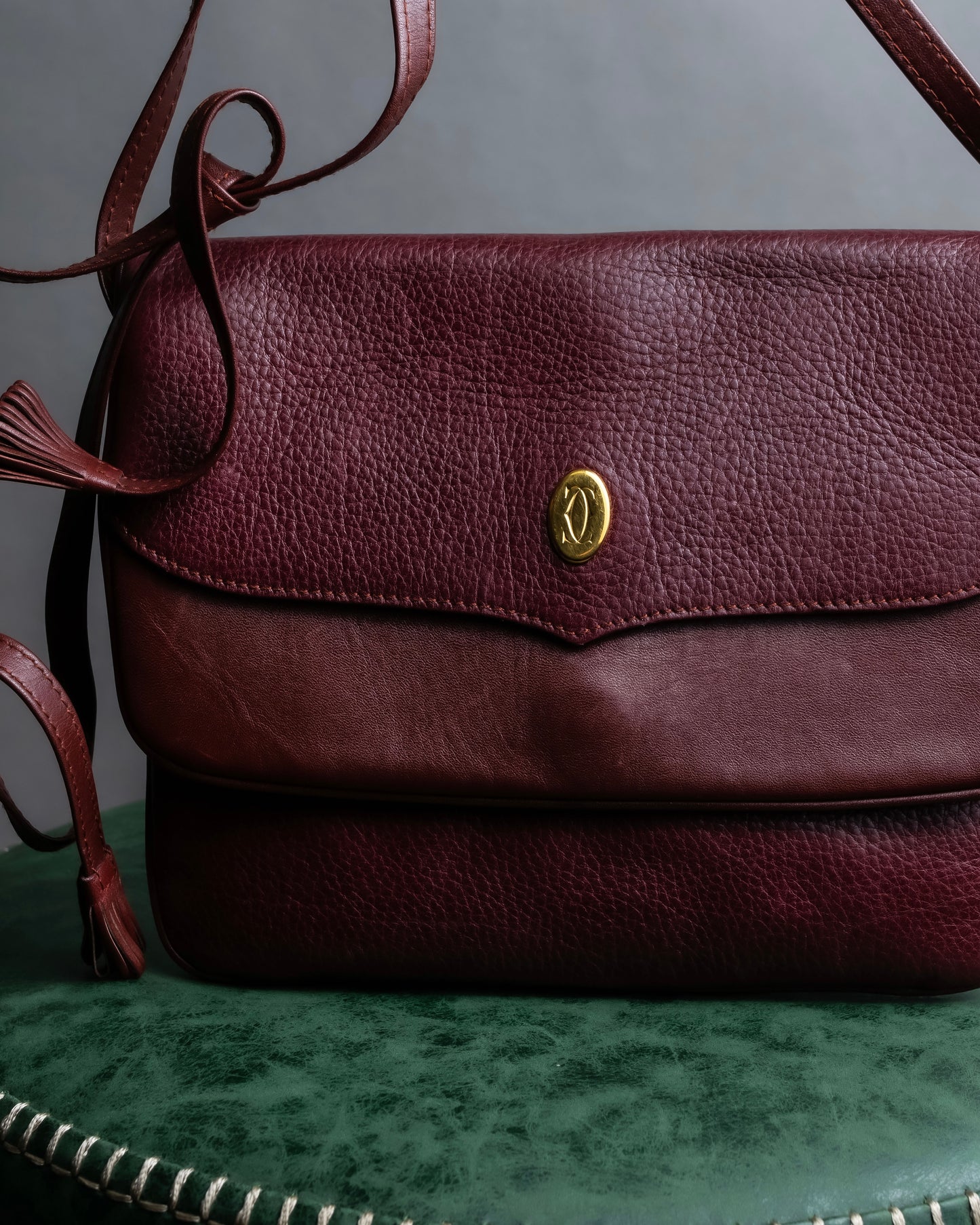 "Cartier" Texture changing bordeaux colored leather shoulder bag