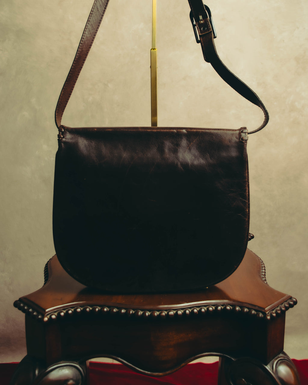 “Yves Saint Laurent” 70’s-80’s Perforated logo leather tassel shoulder bag