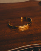 "Daniel Wellington" 20's Sleek gold cuff bracelet