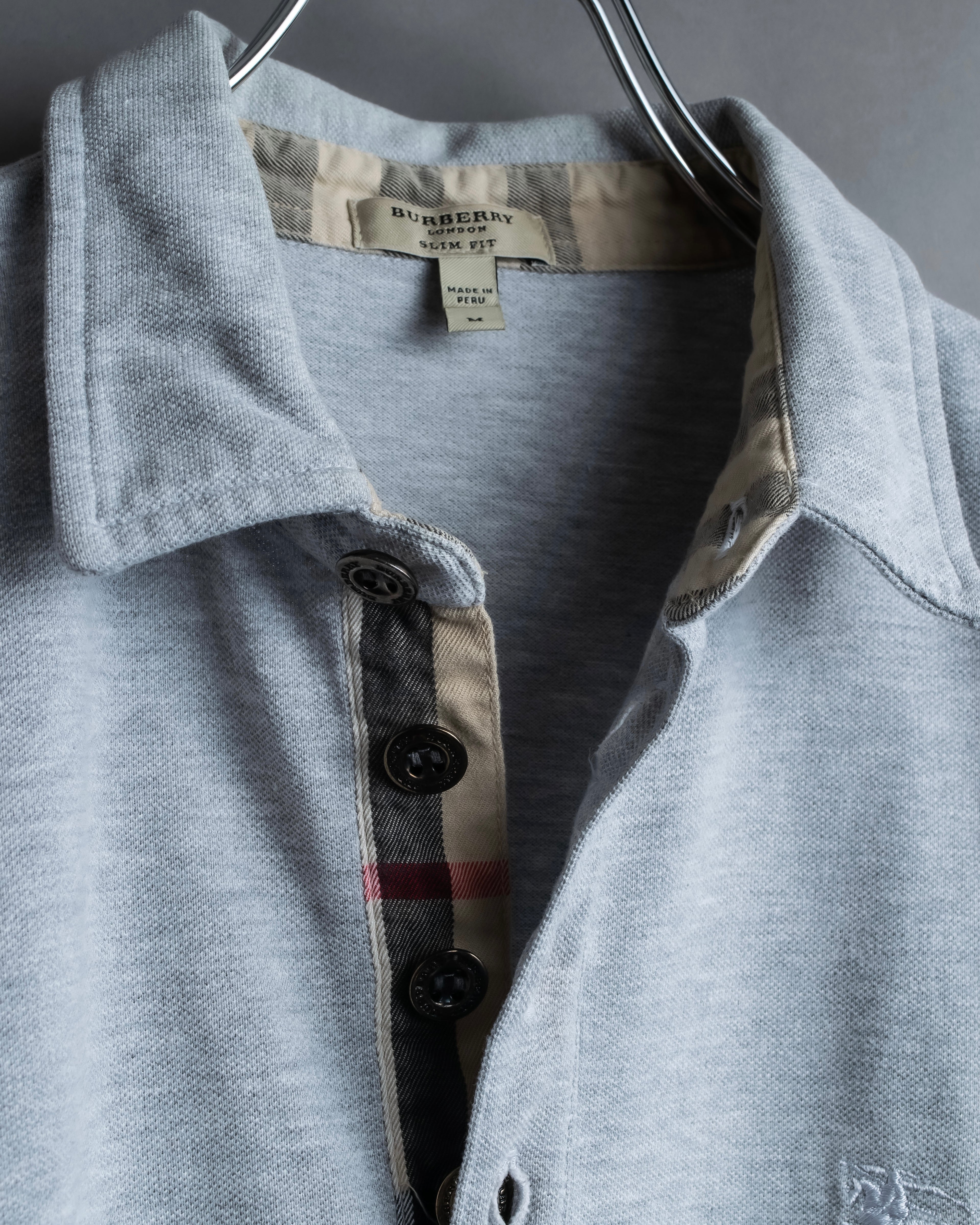 "BURBERRY" Knight logo engraved metal button polo shirt