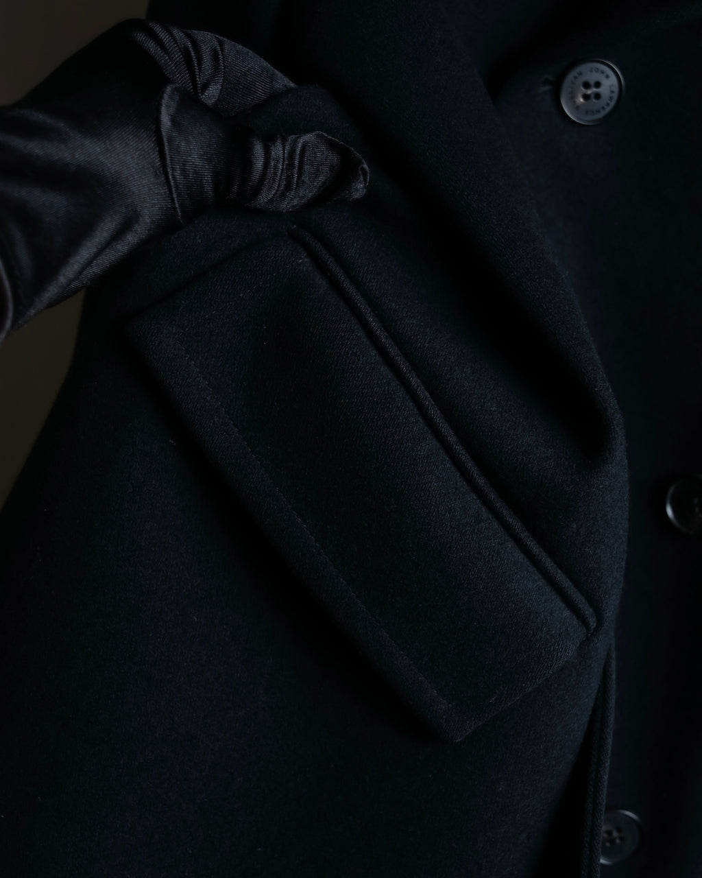 "JOHN LAWRENCE SULLIVAN"
 Large lapel double-breasted mid length coat