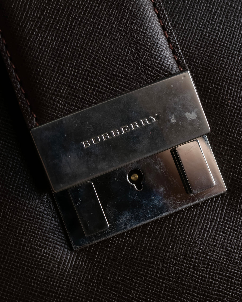 "BURBERRY" Metal belt design embossed PVC briefcase